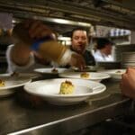Every chef pitched in to help on the plating of every course. Photo by Rachel Bush.