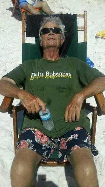 Elderly man sunbathing with sunglasses