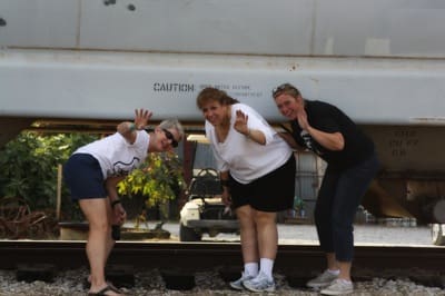 Erin a Semi-Semi-Fixture along with Fixtures Andrea and Shonda as they head over the tracks and under the train to the Shack Up Inn. Photo by The Delta Bohemian