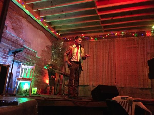 Man performing on a decorated stage