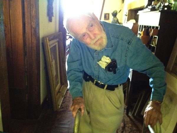 Senior man in denim shirt walking