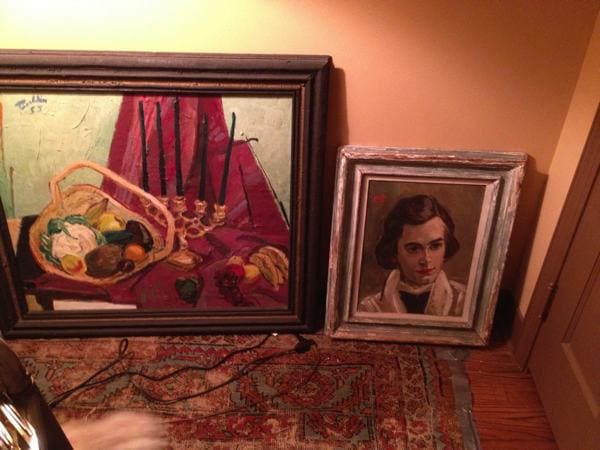 An early still life and a painting of his beloved wife Mel by Marshall Bouldin III leaning against the wall in his bedroom.