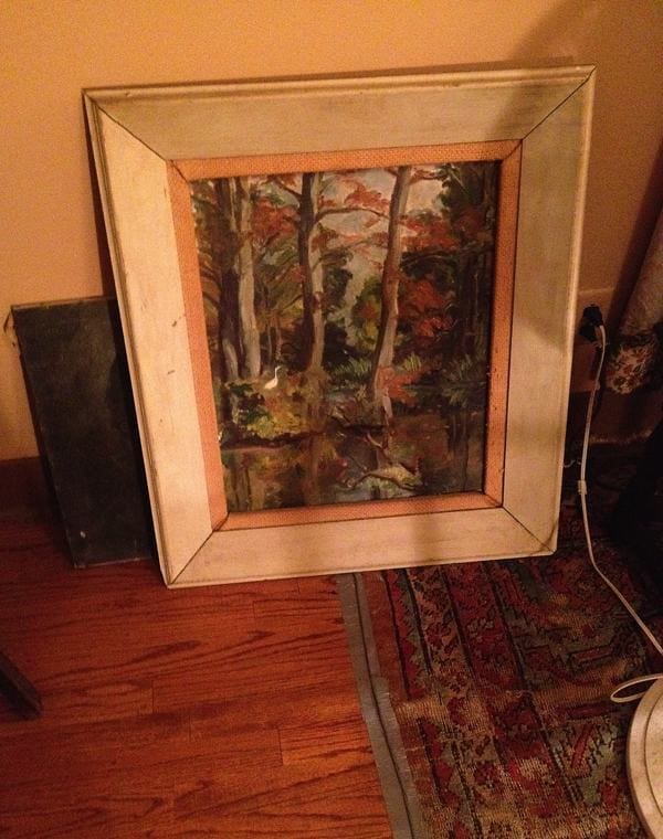 An early landscape painting by Marshall Bouldin III leaning against the wall in his bedroom.