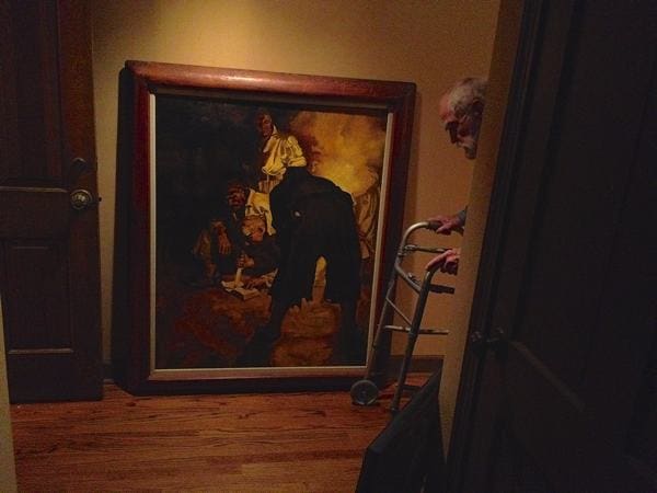 Artist Marshall Bouldin standing beside an early study/copy of a painting by his gifted artist son Jason Bouldin.