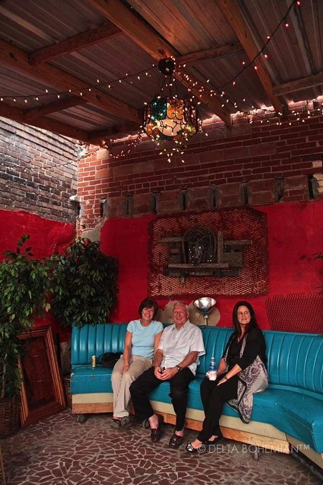 Friends relaxing on a blue couch