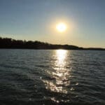 Sunset reflecting on a calm lake.