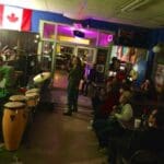 Live band playing in a crowded bar.
