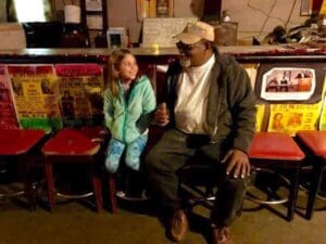 Mia meeting Red Paden inside Red's Lounge in Clarksdale