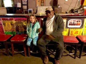 Mia meeting Red Paden inside Red's Lounge in Clarksdale