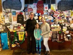 Mia and Mom Jenny meeting Roger Stolle, owner of Cat Head Delta Blues & Folk Art