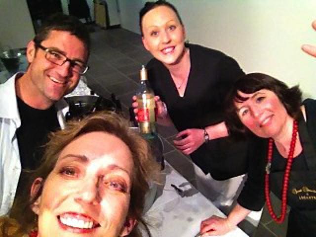 Magical Madge having fun with servers and cool guy at reception.