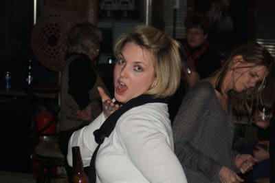 Woman posing playfully at a party