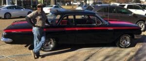 "Big J" Milton Johnson of Johnson Plumbing beside his refurbished 1961 Chevy Bel Air