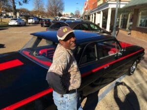 "Big J" Milton Johnson of Johnson Plumbing beside his refurbished 1961 Chevy Bel Air