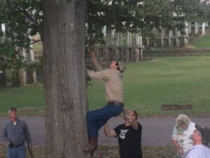 Tree climbing to retrieve disc with group effort
