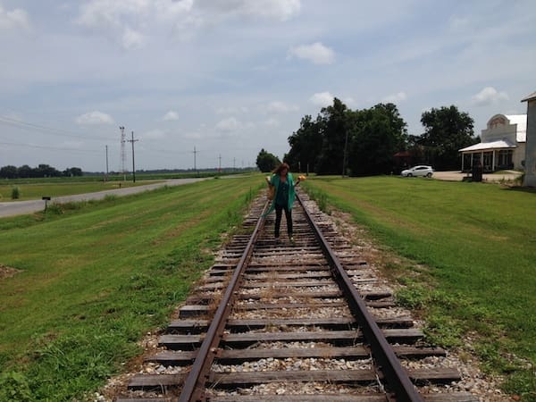 Individual enjoying countryside railroad view
