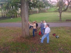 Tree climbing to retrieve disc with group effort