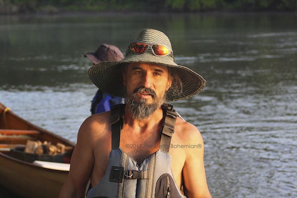 Bearded man outdoors with life vest