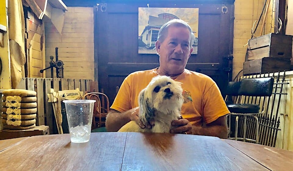 Man with dog in rustic setting