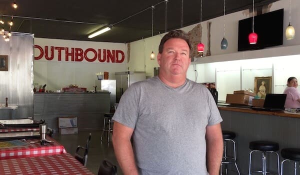 Individual inside a cafe with red decor