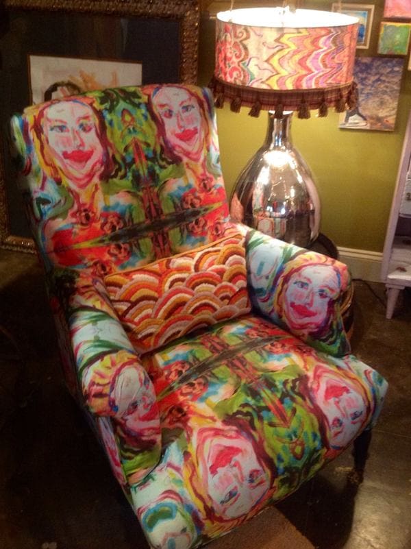 A chair covered in original art fabric by Kim Duease