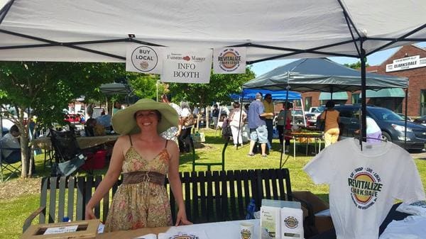 Outdoor market information booth with local products