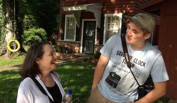 Conversation in front of a house