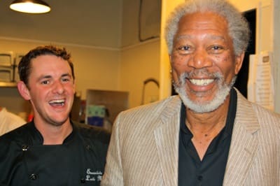 Chef and smiling man in a kitchen