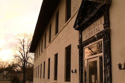Old hospital building exterior at sunset