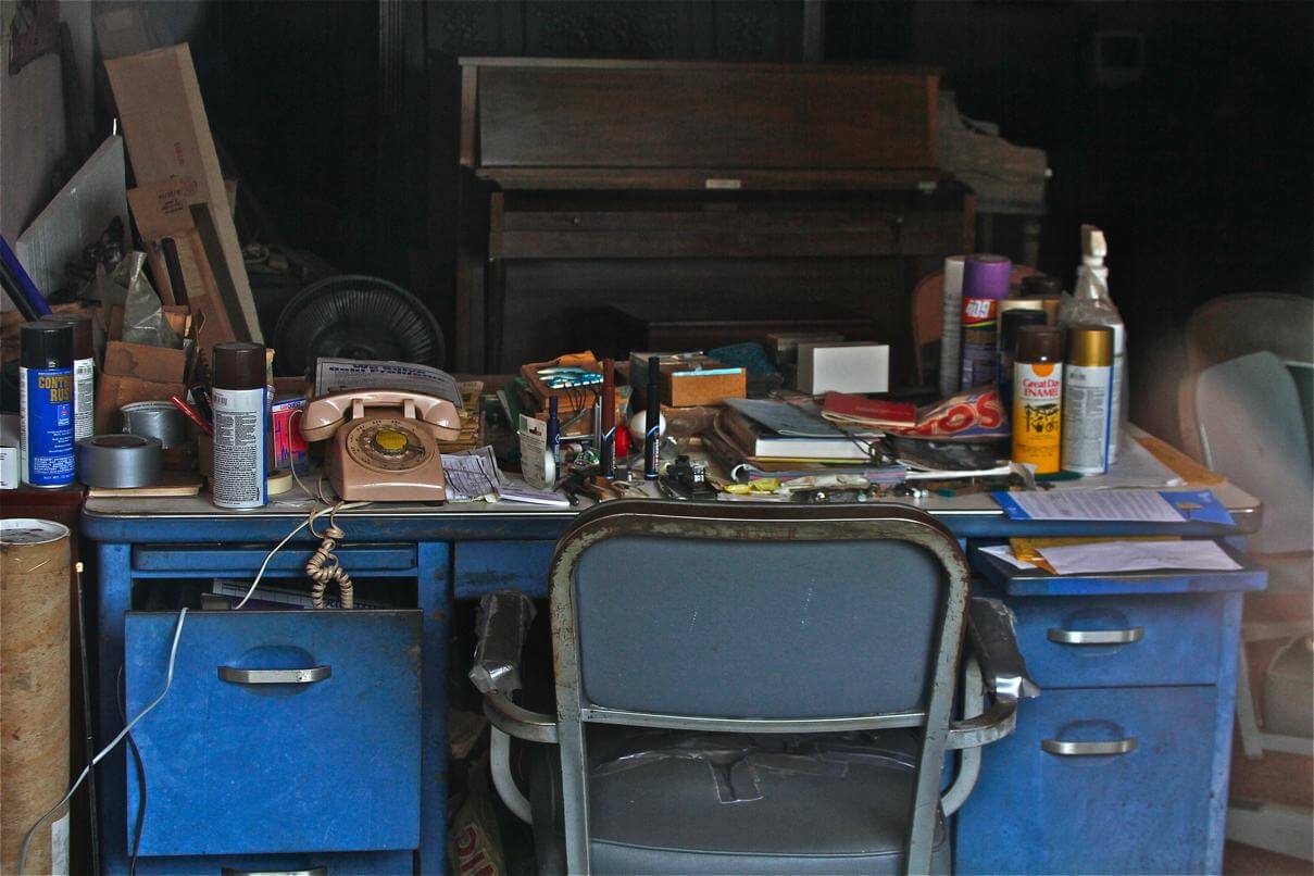 Messy workspace with old telephone