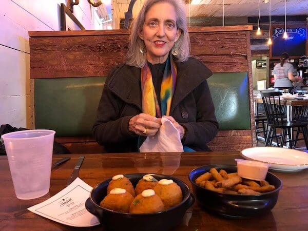 Restaurant scene with woman and appetizers