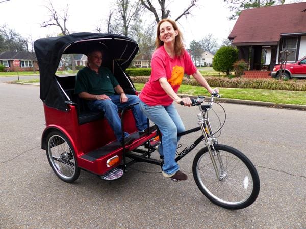 Red rickshaw on suburban street