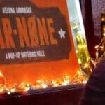Bar-None sign with lights and bottles.