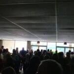 Large group of people gathered indoors.