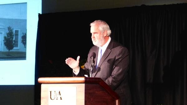 Man speaking at a podium