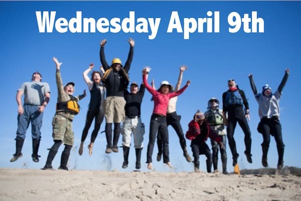 Group jumping on sandy beach