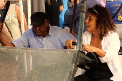 Man and woman in a golf cart