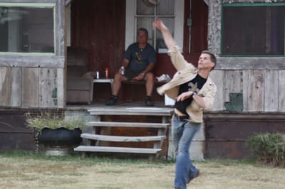 Artist Randall Andrews throwing the football at the Shack Up Inn near Clarksdale, MS. Photo by The Delta Bohemian