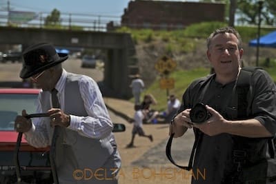 Photographers capturing street scenes outdoors
