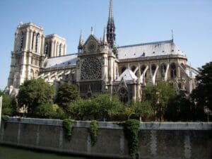 Admiring the Rose Window of Notre Dame Cathedral in Paris. Photo by Guest Bohemian Jay Hughes
