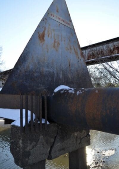 Okay, Maybe there are some Dirty Places -- The Sewer Pipe Crossing -- This is where water level will end up after the weir is constructed -- can this be moved?