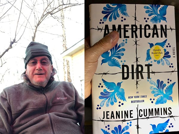 Hand holding "American Dirt" book