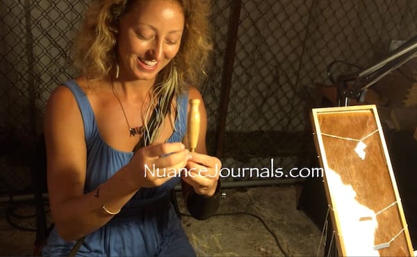 Artist working with wooden sculpture