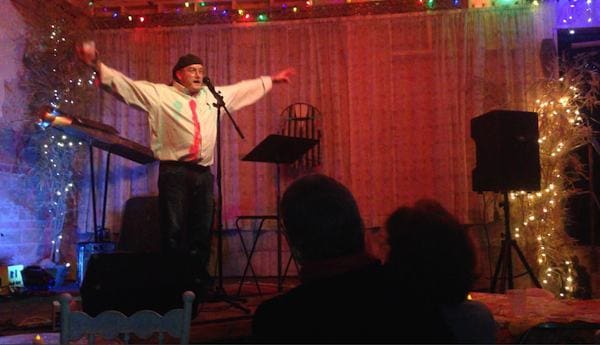 Man performing on stage with microphone