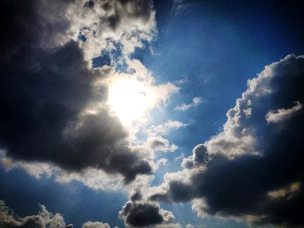 Sun shining through dramatic clouds