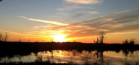Sunset over a tranquil lake reflection