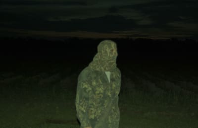 Man in camouflage standing outdoors