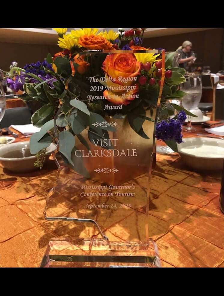 Colorful flowers and engraved award display