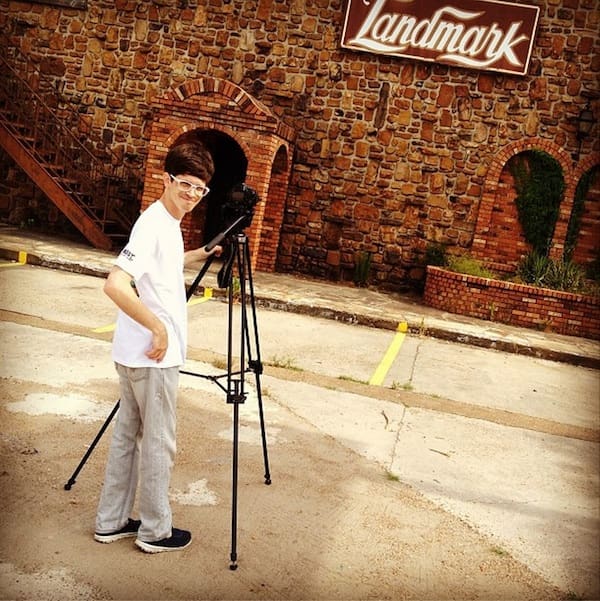 Outdoor photography setup by stone wall