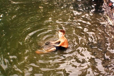 Child enjoying a swim outdoors
